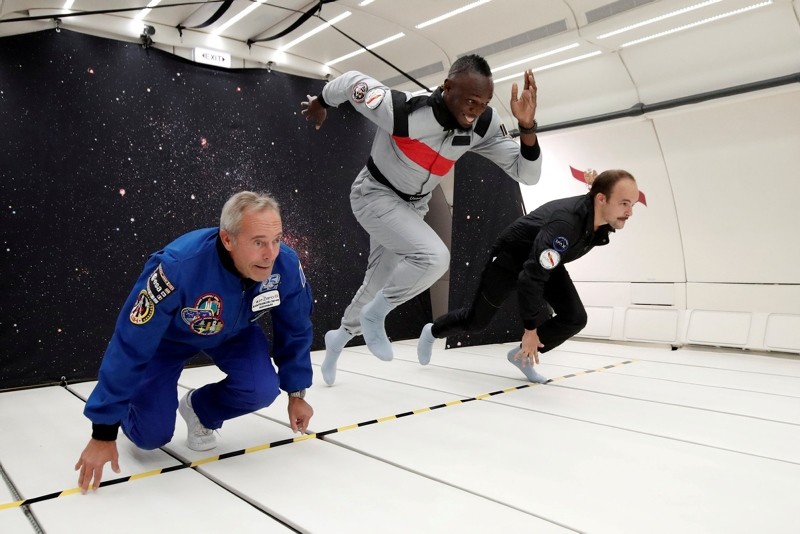 Retired sprinter Usain Bolt, French astronaut Jean-Francois Clervoy and French Interior designer Octave de Gaulle enjoy zero gravity conditions during a flight in a specially-modified Airbus Zero-G plane above France, Sept. 12, 2018. (REUTERS Photo)