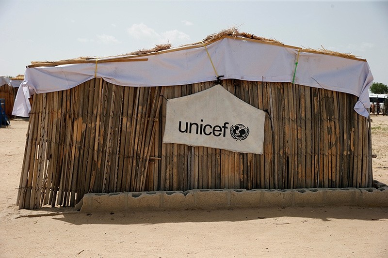 A banner with the UNICEF logo is seen hanging on a makeshift school at an internally displaced persons (IDP) camp on the outskirts of Maiduguri, northeast Nigeria June 6, 2017. (Reuters Photo)