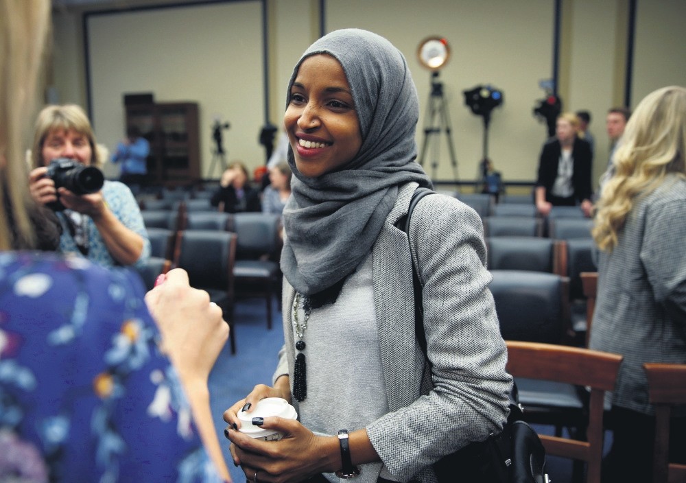 Representative-elect Ilhan Omar speaks to the media after a lottery for office assignments on Capitol Hill in Washington, Nov. 30.