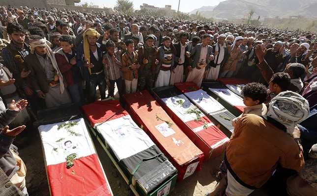 Yemenis gather around the coffins of victims of alleged Saudi-led airstrikes, during a funeral in Sana'a, Yemen, Dec. 26, 2017. (EPA Photo)