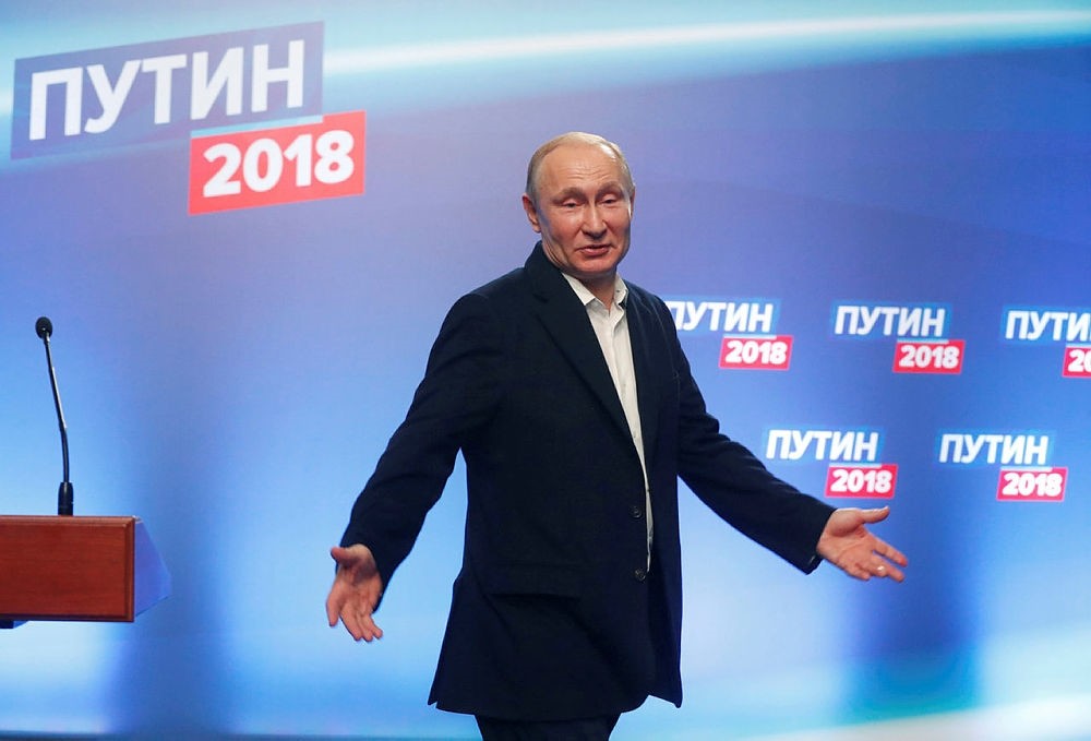 Russian President and Presidential candidate Vladimir Putin arrives at his election headquaters in Moscow, Russia March 18, 2018.  (POOL via Reuters)