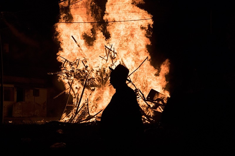 Ultra Orthodox Jews dance around a large bonfire in the neighborhood of Mea Shearim in Jerusalem, Israel (EPA Photo)