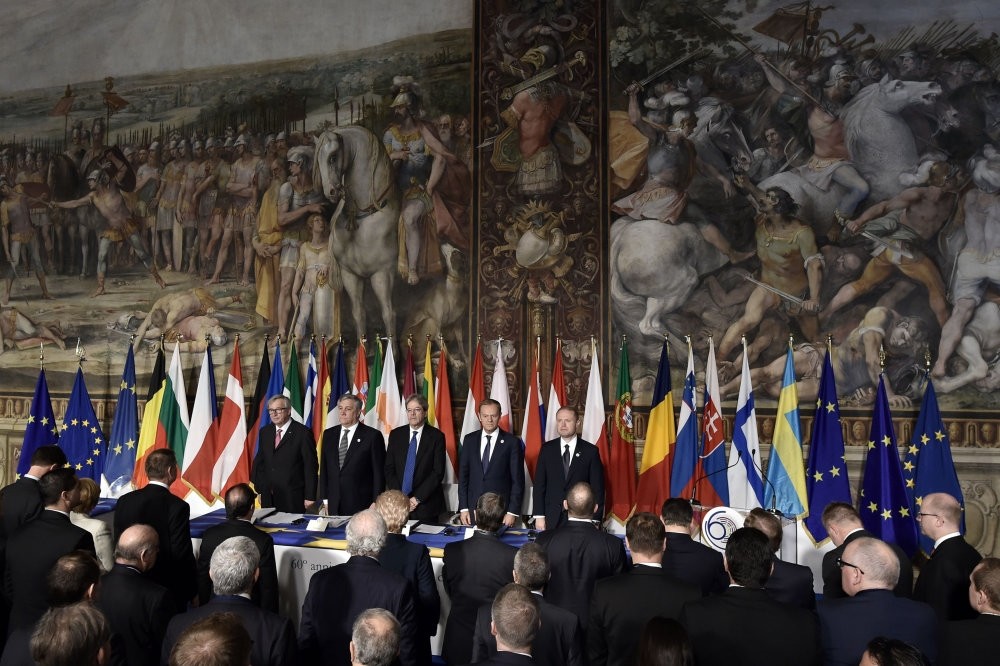 EU officials stand with the leaders of 27 European Union countries during a summit of EU leaders to mark the 60th anniversary of the bloc's founding Treaty of Rome, at Rome's Piazza del Campidoglio (Capitoline Hill), March 25, 2017.