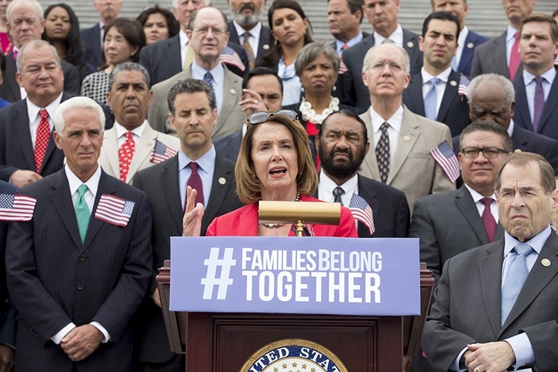 House Minority Leader Democrat Nancy Pelosi (C) delivers remarks on immigration beside House Democrats at the East Front steps of the House of Representatives, on Capitol Hill in Washington, D.C., USA, June 20, 2018. (EPA Photo)