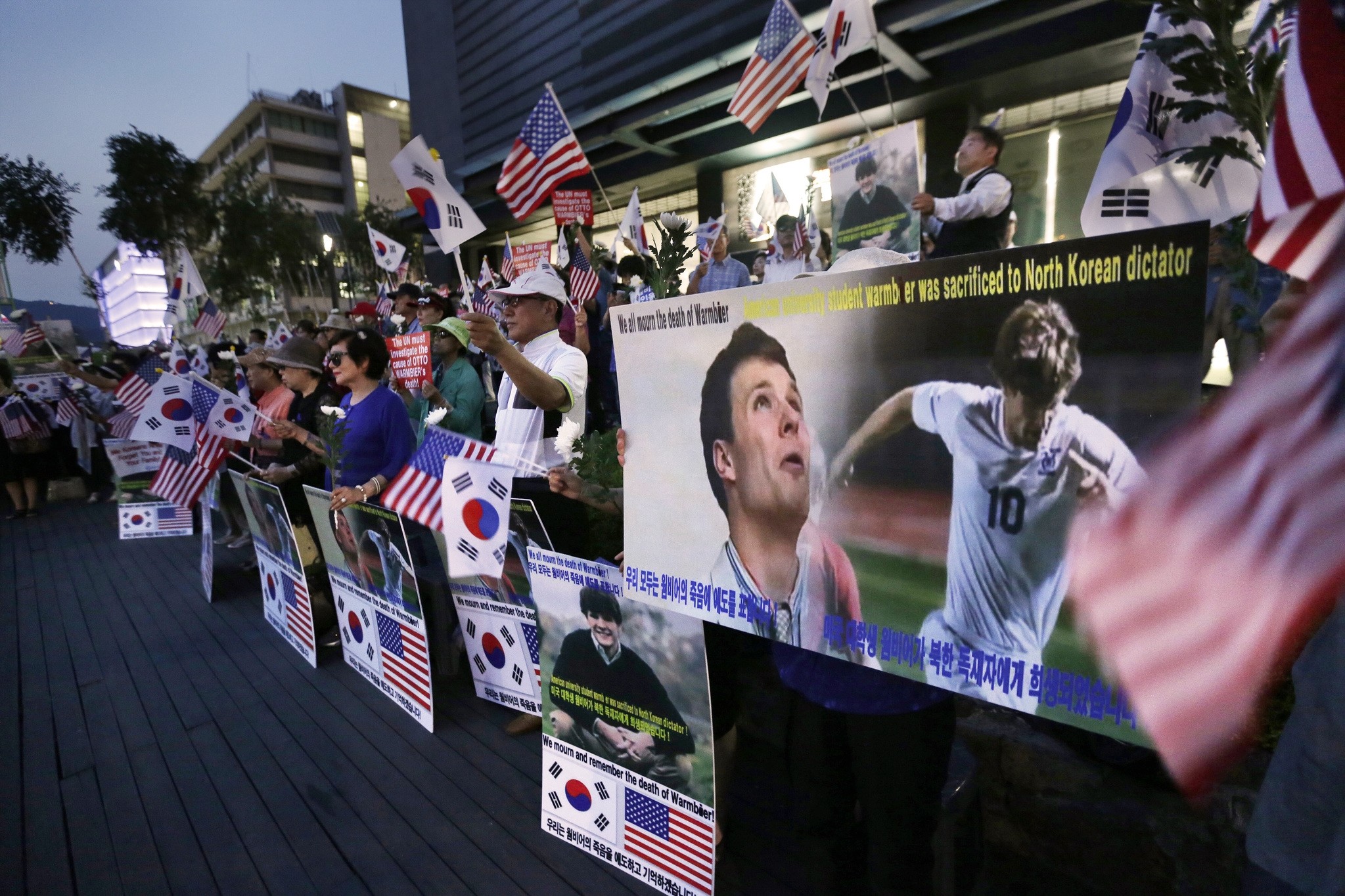 Supporters stage a memorial rally for the late American student Otto Warmbier near the U.S. Embassy in Seoul, South Korea, Friday, June 23, 2017. (AP Photo)