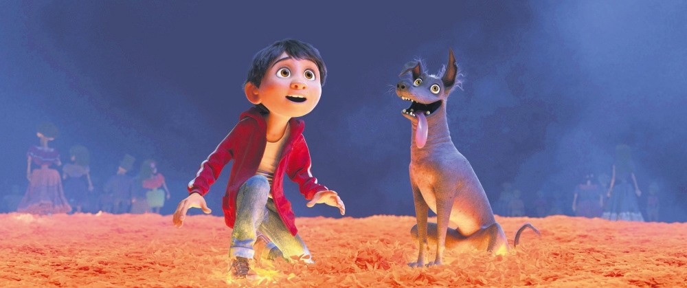 Disney-Pixar characters Miguel, voiced by Anthony Gonzalez, left, and Dante in a scene from the animated film, ,Coco,, one of the largest U.S. productions ever to feature an almost entirely Latino cast.