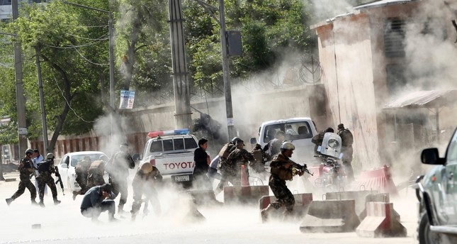 Security forces run from the site of a suicide attack after the second bombing in Kabul, Afghanistan, Monday, April 30, 2018 (AP File Photo)
