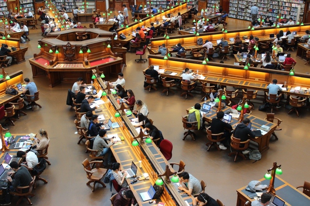 Students studying at a university library.