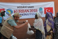 A charity worker delivers aid in Burkina Faso.
