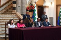 Photo released by Bolivian Presidency shows Bolivia's interim President Jeanine Anez speaking next to Bolivian Chancellor Karen Longaric (2nd L), Comunication Minister Roxana Lizarraga (L), Minister of Government Yerko Nunez (2nd R) and Defense Minister Fernando Loperz (R) during a news conference. (AFP Photo/Bolivian Presidency)