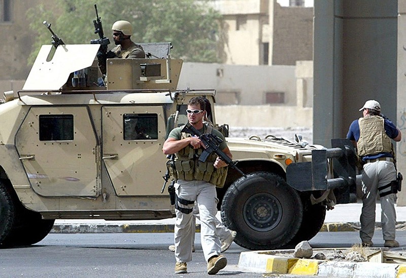 July 2005 file photo shows Blackwater private security contractors near Iranian embassy in Central Baghdad. (AFP/Getty Images)