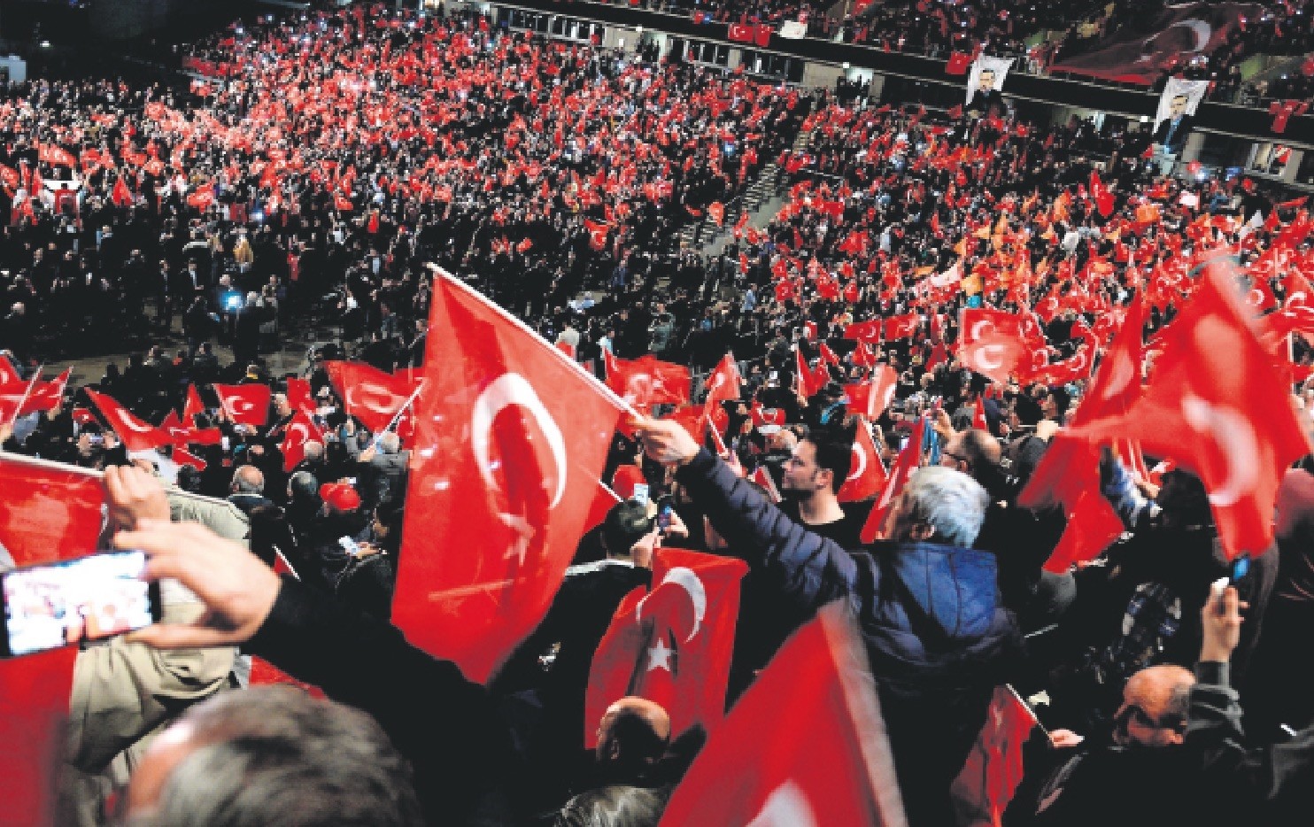 Participants wave Turkish flags peacefully during a meeting held in Germany by Turkish Prime Minister Binali Yu0131ldu0131ru0131m in Oberhausen, Feb. 18, 2017.