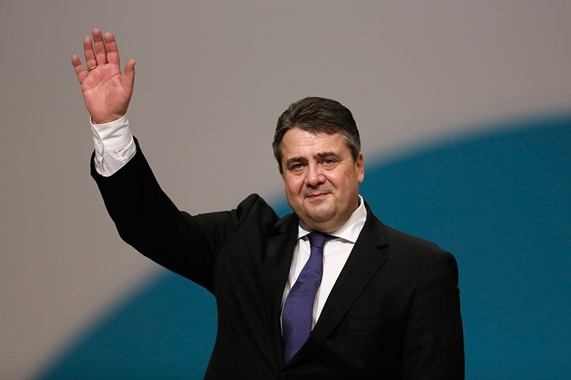 In this Dec. 11, 2015 file photo German Foreign Minister Sigmar Gabriel waves to the delegates as he receives the applause after his speech during the Social Democratic party convention in Berlin. (AP Photo)