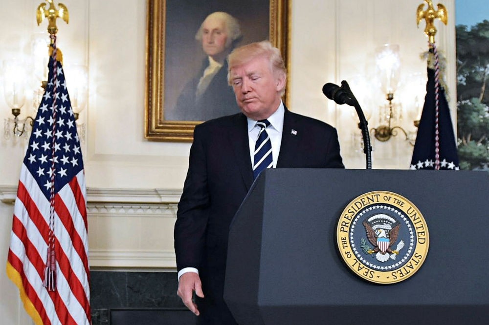 President Donald Trump talks from the Diplomatic Reception Room of the White House in Washington, Oct. 2.