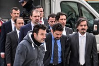 Eight military officers linked to FETu00d6 walk to a Greek courthouse on Jan. 26, 2017, one year after they fled to Greece from Turkey where they participated in a coup attempt.