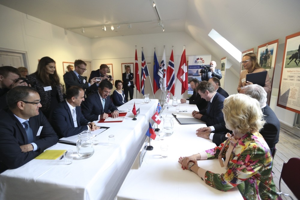 Economy Minister Nihat Zeybekci (third from left) at the signing ceremony of the expanded and modernized free trade agreement (FTA) with the European Free Trade Association (EFTA), Saudarkrokur, Iceland, yesterday.