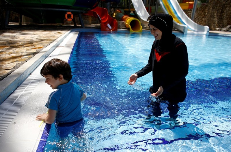 Guests enjoy the pool at Wome Deluxe Hotel, a halal friendly holiday resort, in Alanya, Turkey (Reuters Photo)