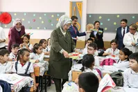 First lady Emine Erdou011fan personally delivered notebooks to students at a school in Esenler, Isanbul, Sept. 13, 2019.