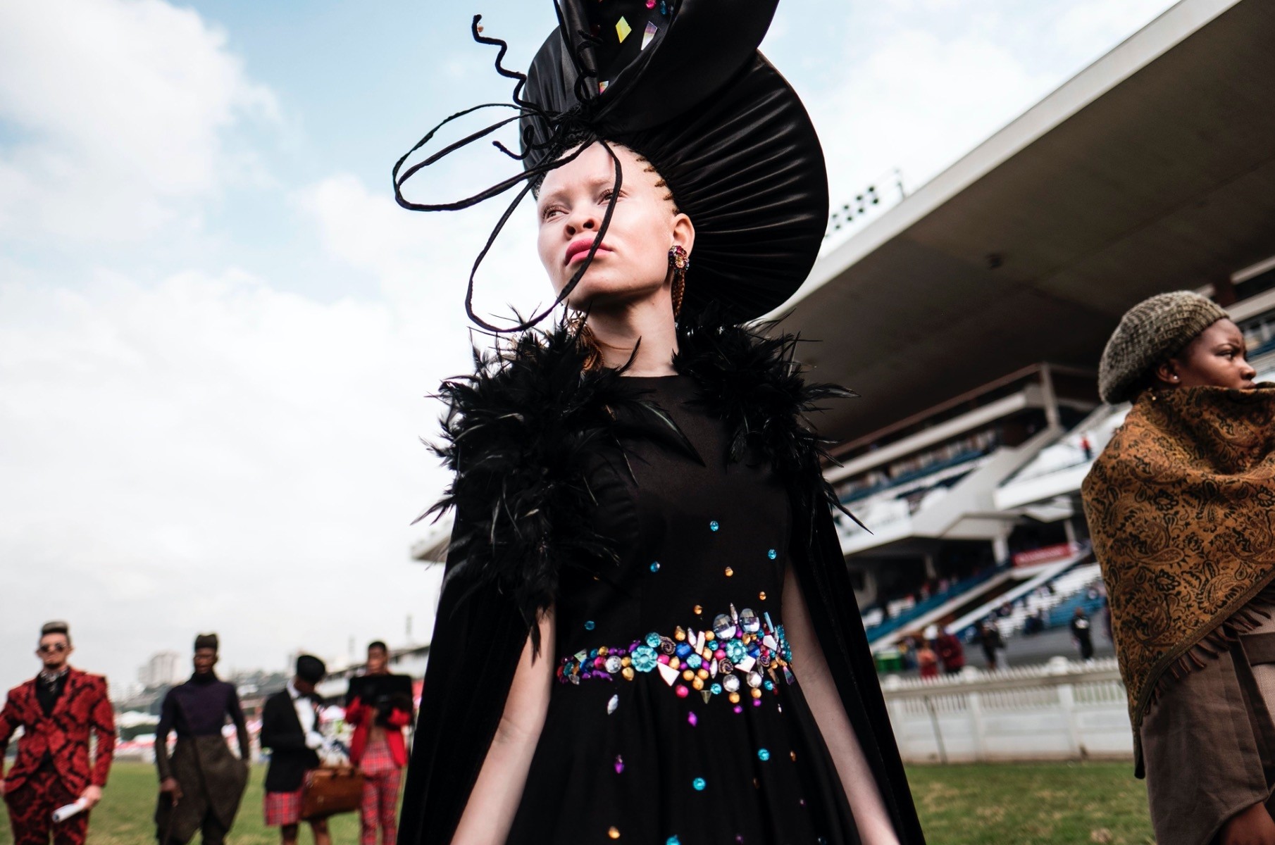 An Albino model presents a creation by a local designer during a fashion show at the 2017 Durban July horse race.
