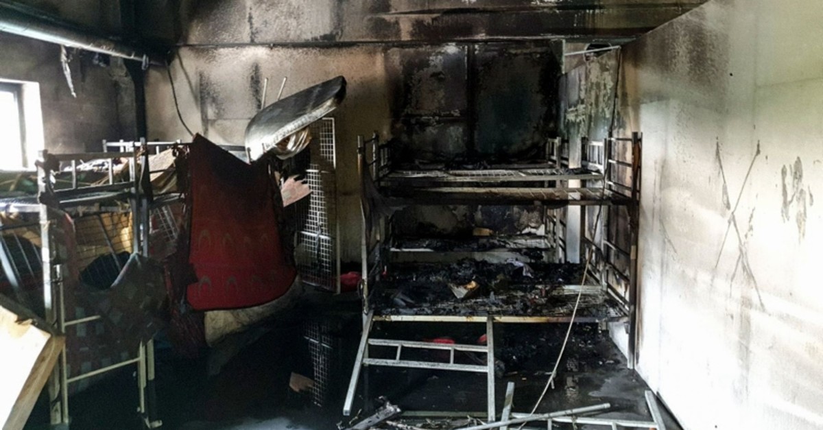 A picture taken on June 1, 2019 shows the aftermath of a fire in a shelter for migrants in the town of Velika Kladusa. (AFP Photo)