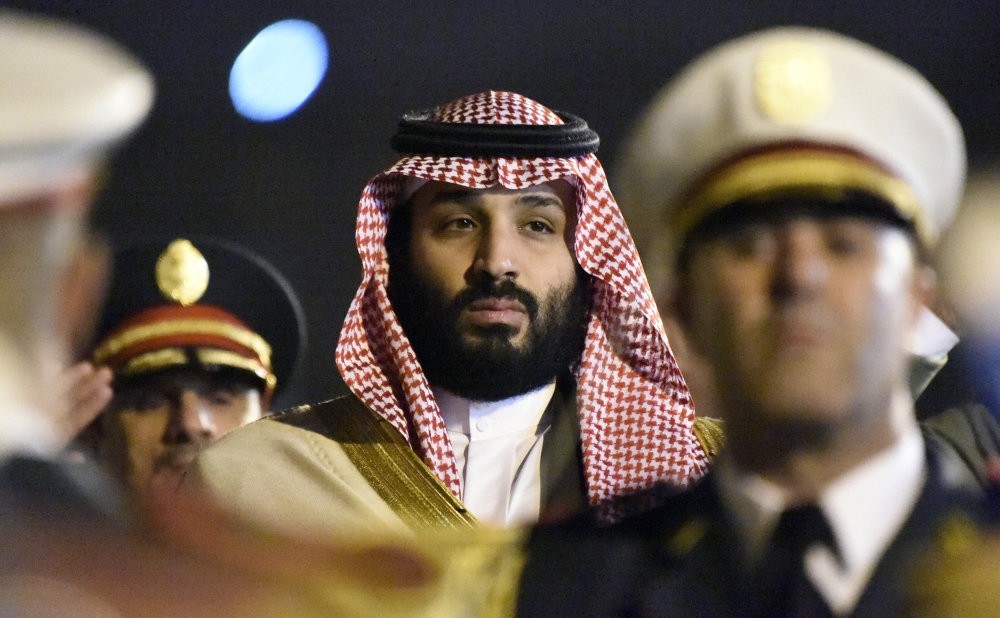 Saudi Crown Prince Mohammed bin Salman is seen behind a military band upon his arrival at Algiers International Airport, Dec. 2.