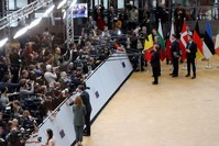 Germany's Chancellor Angela Merkel (R) and Luxembourg's Prime Minister Xavier Bettel (L) answer journalists' questions as they arrive for a special European Council summit, Brussels, Feb. 20, 2020, held to discuss the next long-term budget of the EU. (AFP Photo)