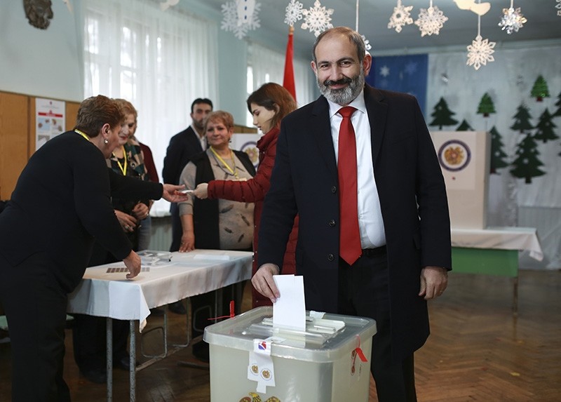 Acting Armenian Prime Minister Nikol Pashinian casts his ballot in a polling station during an early parliamentary election in Yerevan, Armenia, Sunday, Dec. 9, 2018. (AP Photo)