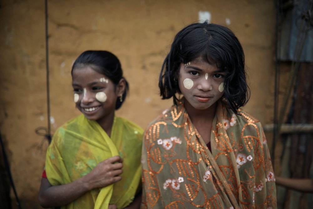 Rohingya refugee girls react to the camera in the Kutupalong camp, Cox's Bazar, Oct. 13.