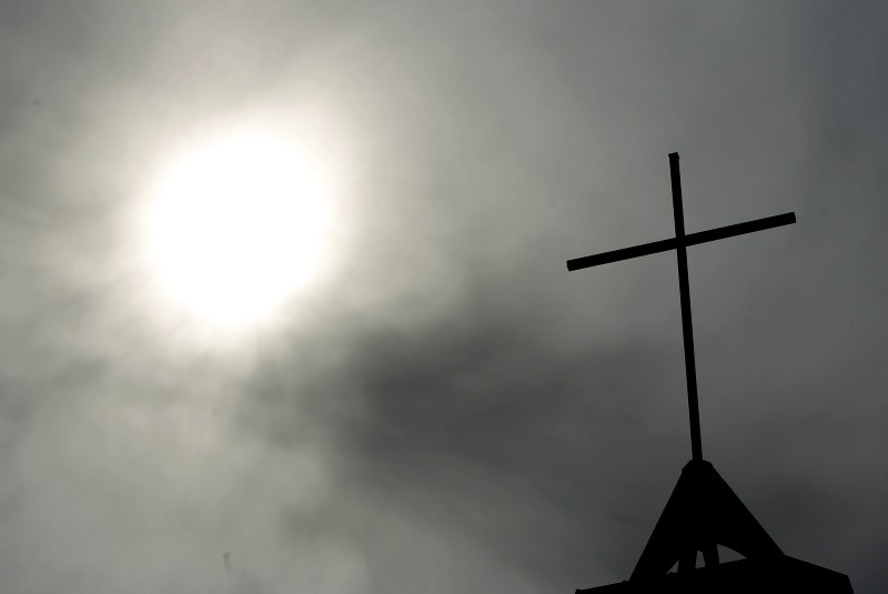  In this April 8, 2010 file photo a cross sits on top of a church in Berlin, Germany. (AP Photo)