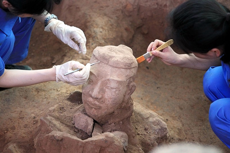 This picture taken on June 9, 2012 shows Chinese archaeologists at work in the extended excavation of the Pit One of the Terracotta Warriors and Horses Museum in Xian (AFP File Photo)