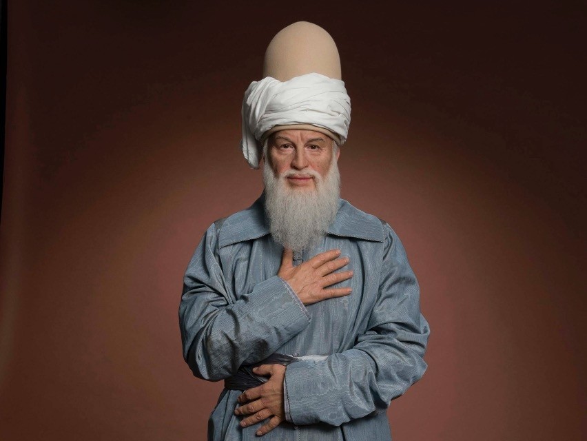 Wax sculpture of Rumi at Madame Tussauds.