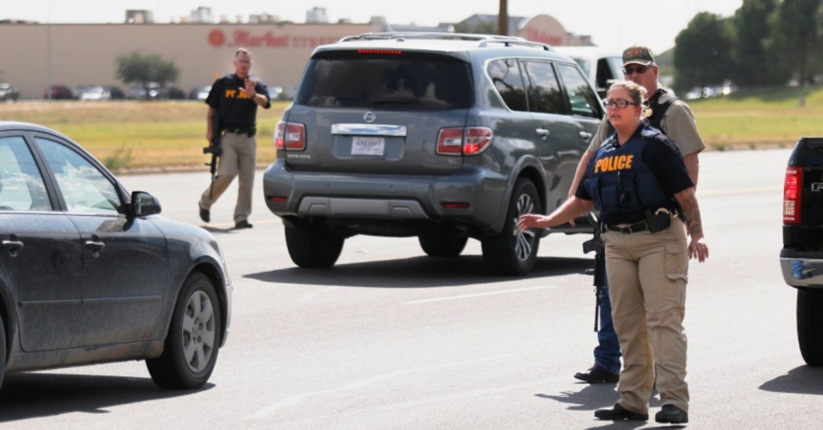 Authorities control traffic on the E. 42nd Street in Odessa, Texas, Saturday, Aug. 31, 2019. (AP Photo)