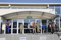 Soldiers stand guard outside a courthouse in Istanbul's Silivri district where pro-coup soldiers accused of killing 34 people are being tried.