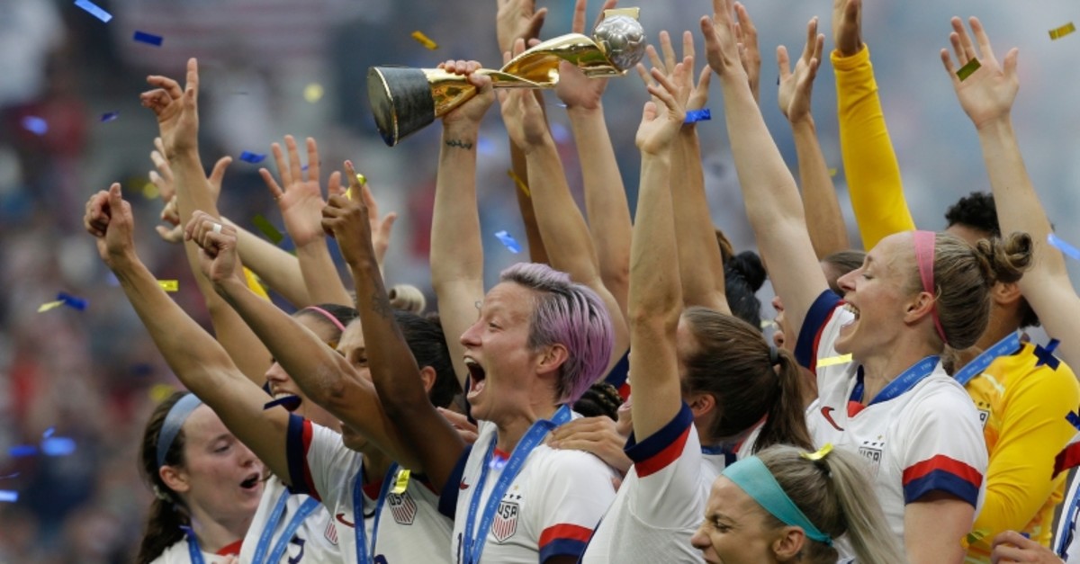 In this July 7, 2019, file photo, U.S. player Megan Rapinoe holds the trophy after winning the Women's World Cup final soccer match against The Netherlands at the Stade de Lyon in Decines, outside Lyon, France. (AP Photo)