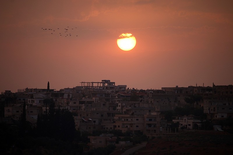 A general view shows the sun setting over a opposition-held area in the southern Syrian city of Daraa on May 28, 2018. (AFP Photo)
