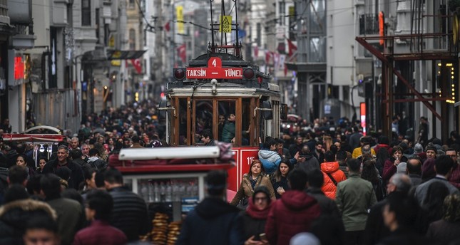 A tramway drives through a crowd in İstiklal Avenue, Istanbul, Jan. 25, 2019. The happiness rate dropped in the country last year though hopes for a better future prevail according to a TurkStat survey.