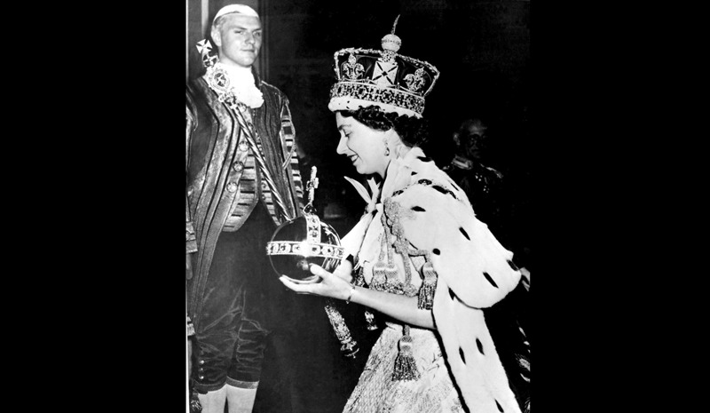 In this June 2, 1953 file photo, Britain's Queen Elizabeth II wearing the bejeweled Imperial Crown and carrying the Orb and Scepter with Cross, leaves Westminster Abbey, London, at the end of her coronation ceremony. (AP File Photo) 