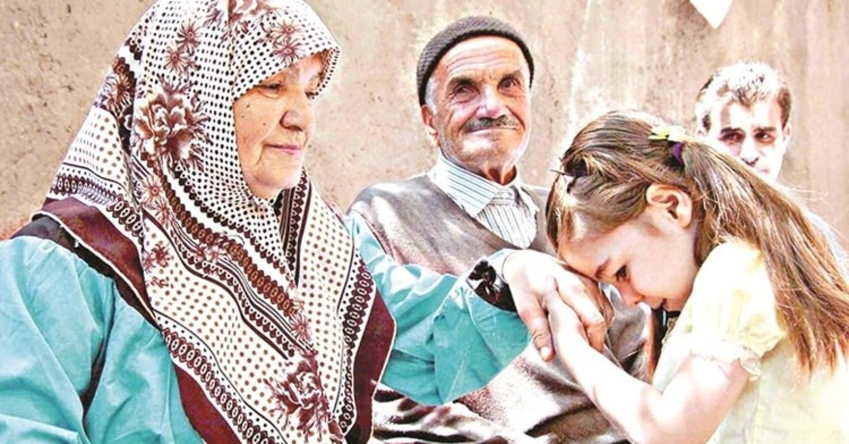 Children kiss the hands of elders to celebrate eid.
