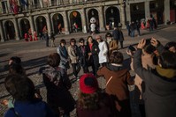Tourists pose for a photograph at Mayor square in central Madrid. Spain says it has broken its record of international visitors for the fifth consecutive year in 2017 with 82 mn tourists that chose restive Catalonia as their main Spanish destination.