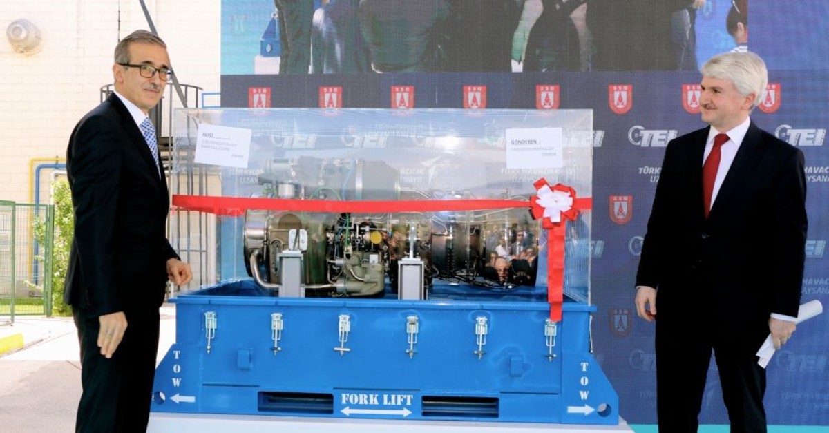 Def. Industries Pres. u0130. Demir (L) and TUSAu015e Engine Industries General Manager M.F. Aku015fit participated in the ceremony held for the delivery of first domestically developed turboshaft engine that will power the domestic Black Hawk helicopters to TAI