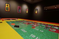 The gallery resembles a casino and visitors are invited to place play bets on the roulette table, and by doing so, change the fates of numerous people whose life stories Duben meticulously collected over the years.