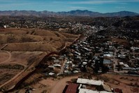 The U.S. border fence separates Nogales, Mexico, right, from sister city Nogales, Arizona, left, Friday, Jan. 3, 2020. (AP Photo)