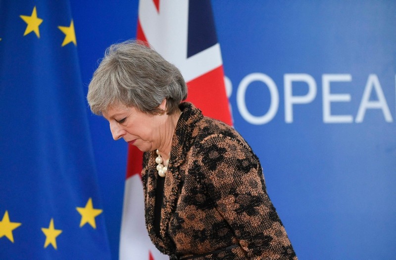 In this file photo taken on December 14, 2018 Britain's Prime Minister Theresa May leaves after speaking during a press conference on December 14, 2018 in Brussels. (AFP Photo)