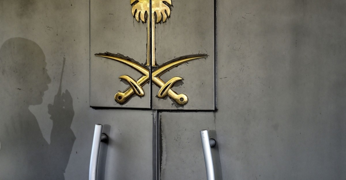 A shadow of a security member of the consulate is seen on the door of the Saudi Arabian consulate on November 1, 2018 in Istanbul. (AFP Photo)