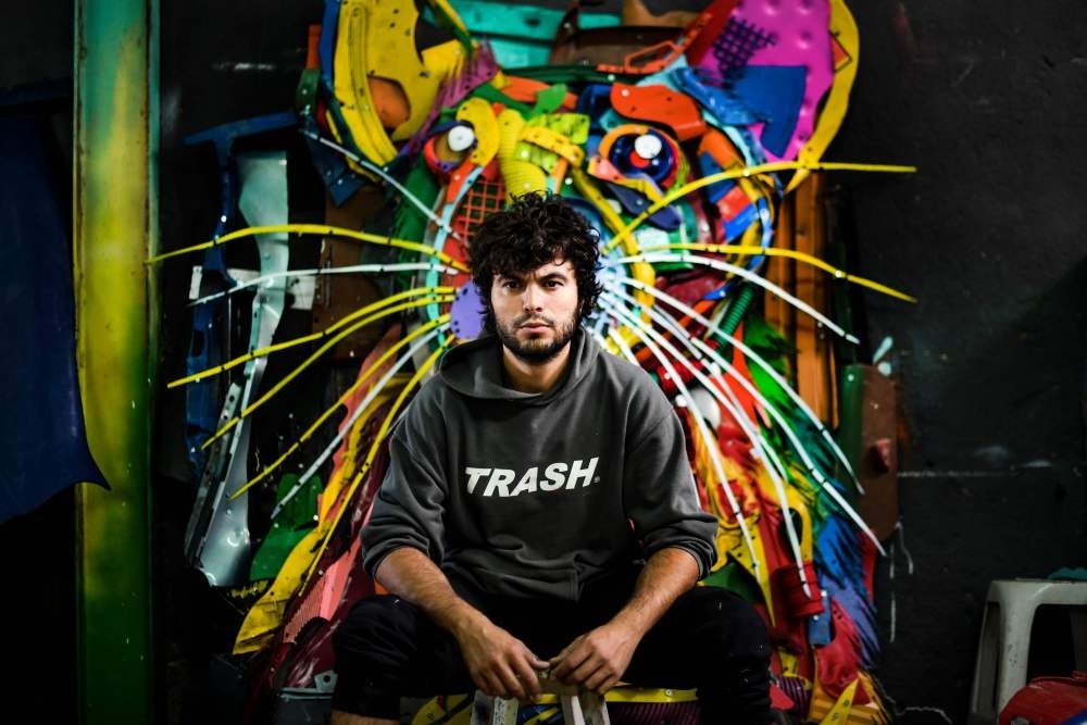 Artur Bordalo, who goes by the artistic name Bordalo II, poses in his studio in Lisbon.