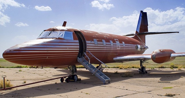 This undated photo provided by GWS Auctions, Inc. shows a private jet once owned by Elvis Presley, on a runway in New Mexico. (AP Photo)