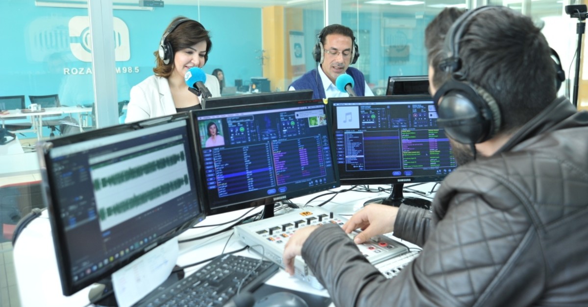 Presenters during a show at Rozana FM's studio in Gaziantep, March 25, 2019. 