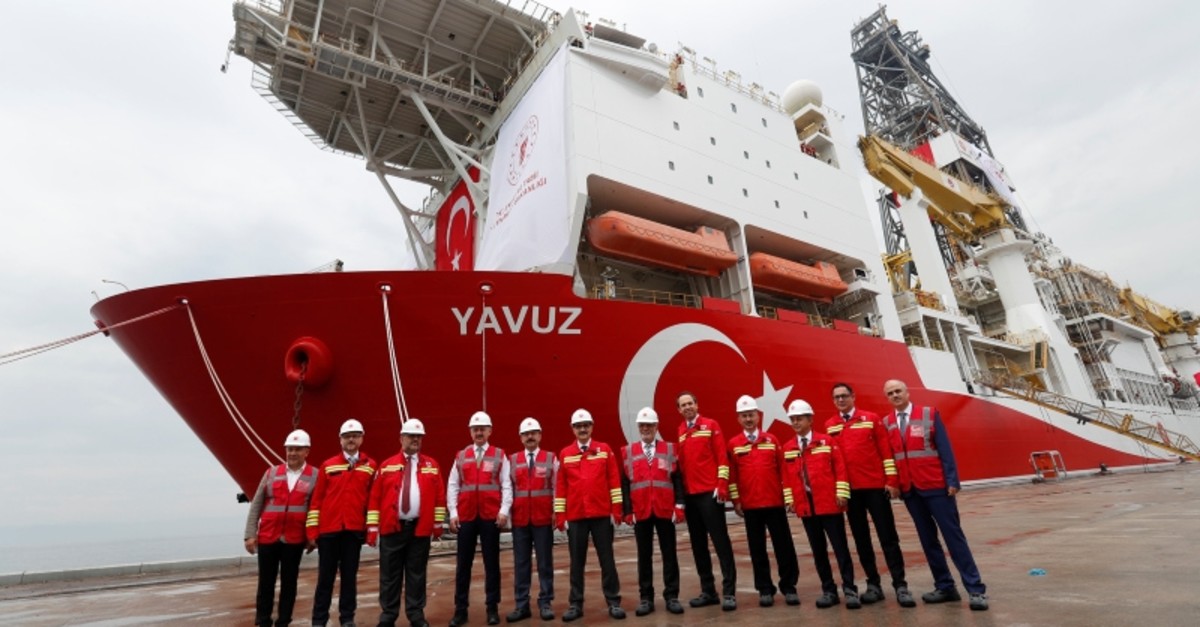 Turkey's Energy Minister Fatih Du00f6nmez and the other officials pose in front of the Turkish drilling vessel Yavuz at Dilovasu0131 port in the northwestern Kocaeli province, Turkey, June 20, 2019. (Reuters Photo)
