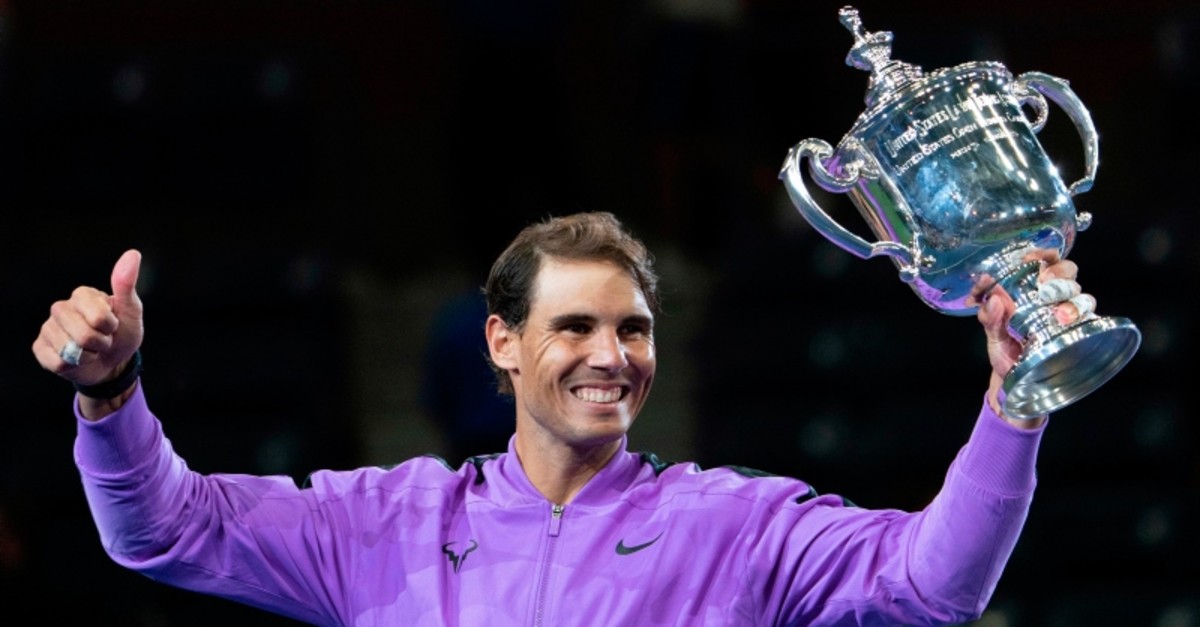 Rafael Nadal, of Spain, holds up the championship trophy after defeating Daniil Medvedev, of Russia, to win the men's singles final of the U.S. Open tennis championships Sunday, Sept. 8, 2019, in New York. (AP Photo)