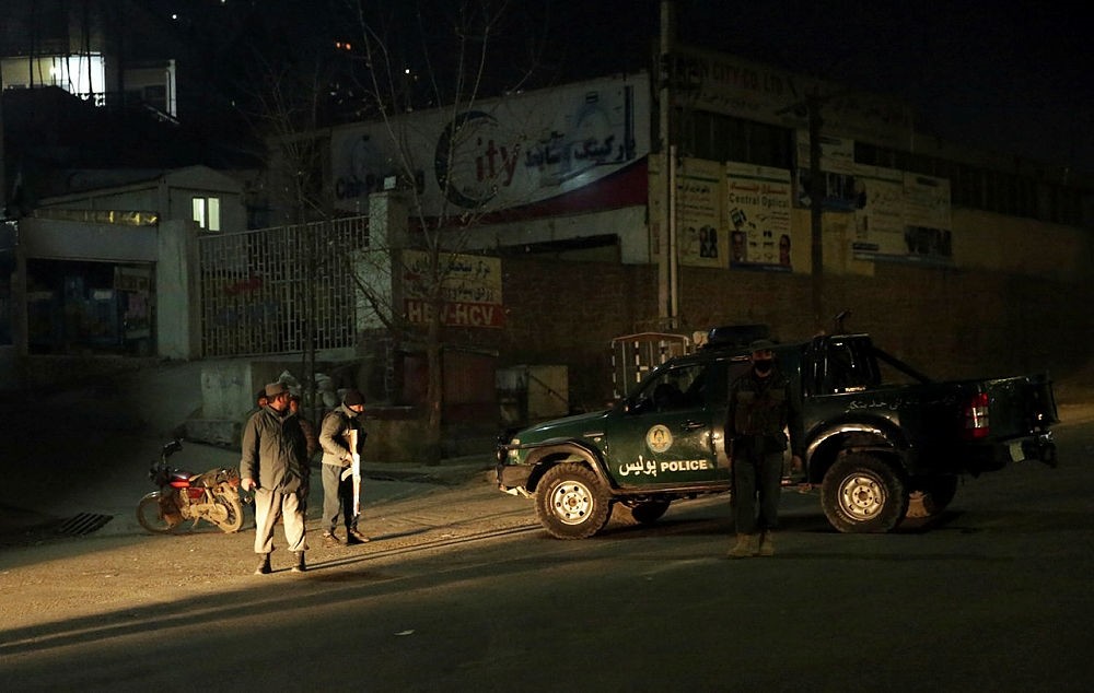 Policemen block the main road near the Intercontinental Hotel after a deadly attack in Kabul, Afghanistan, Saturday, Jan. 20, 2018. An Afghan official says that a group of gunmen have attacked the Intercontinental Hotel in the capital Kabul. (AP Phot